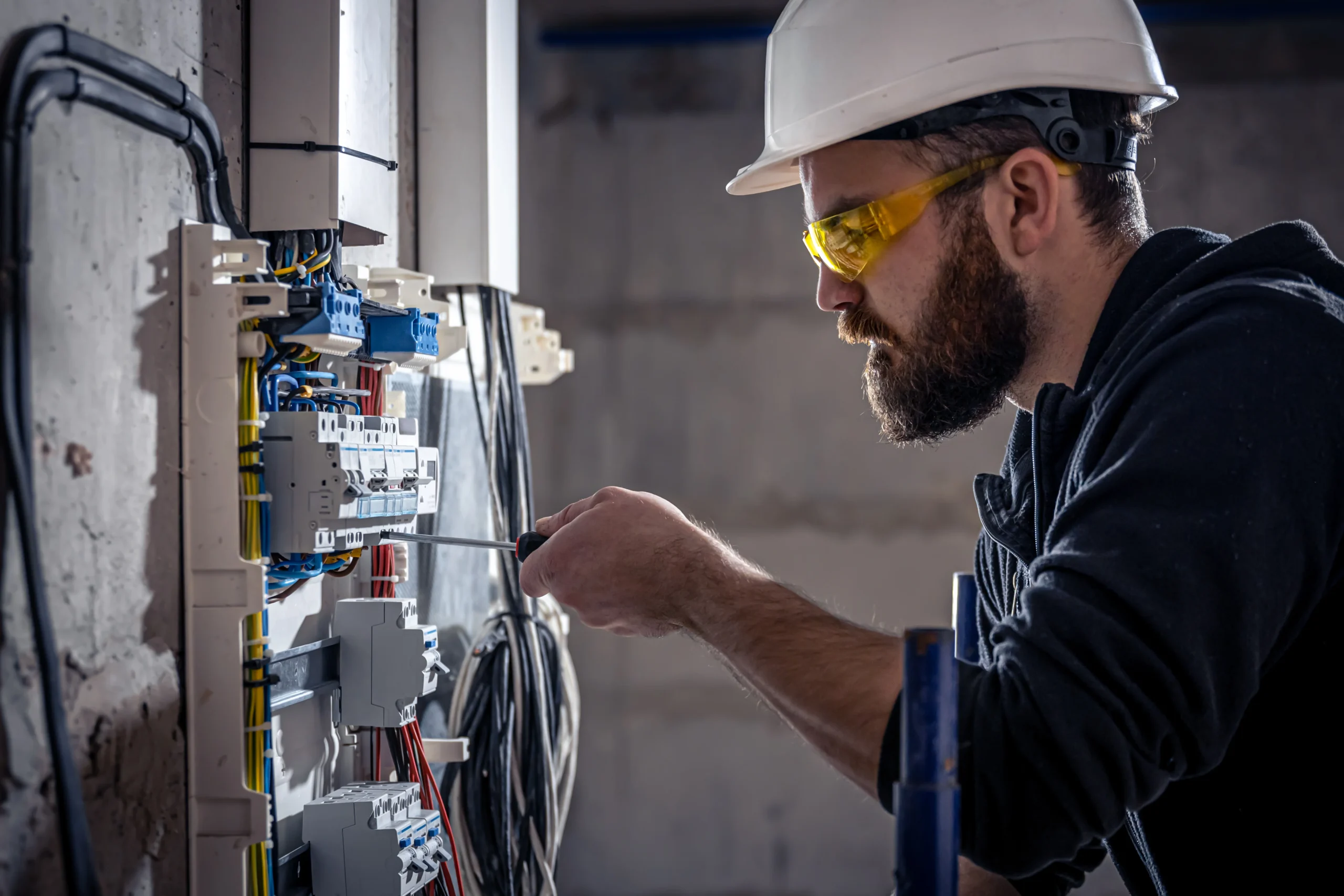 Power Fusion electrician working on an electrical panel